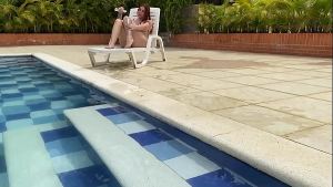 NAUGHTY REDHEAD TASTES AND RIDES A BIG COCK IN THE POOL – ANDY ROSE